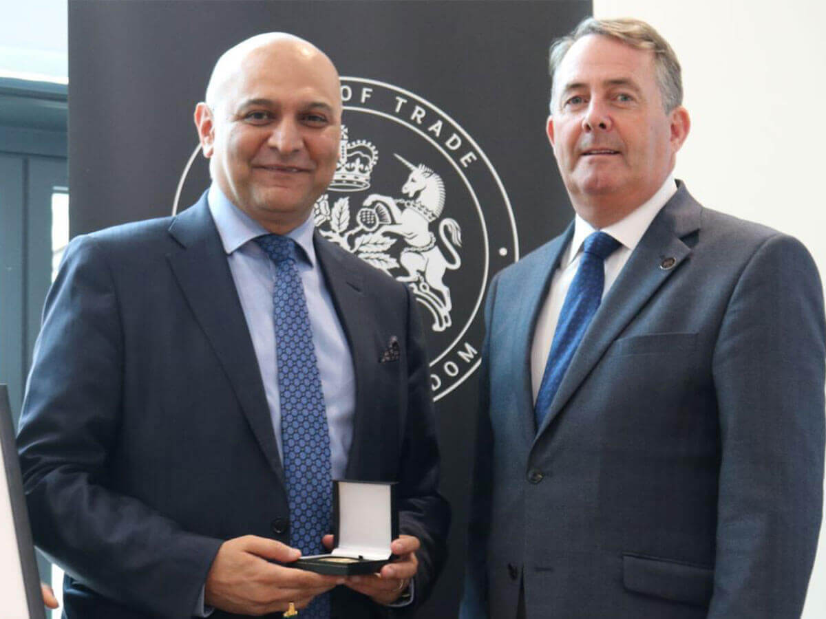 Dr Nik Kotecha OBE, Chief Executive of Morningside Pharmaceuticals, receiving a Board of Trade Award, from Secretary of State for the Department for International Trade