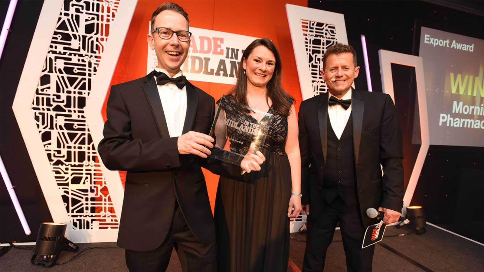 Alex Claydon accepts an Insider Media Made in the Midlands Award from the BBC's Mike Bushell